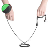 Wrist-type pet watch leash shown in hands with green and black design, featuring a 3-meter high strength polyester rope.