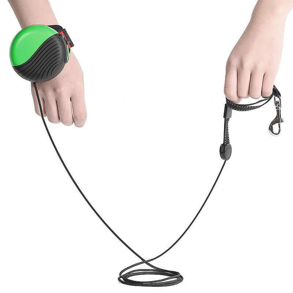 Wrist-type pet watch leash shown in hands with green and black design, featuring a 3-meter high strength polyester rope.